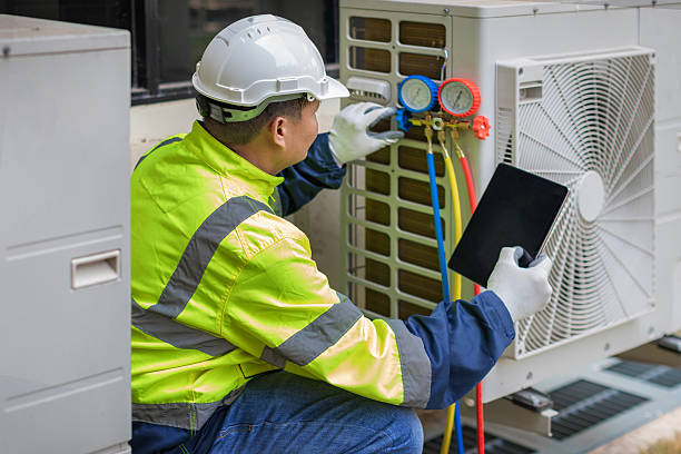 Professional Air Conditioning Repair technician working in Huggins, MO